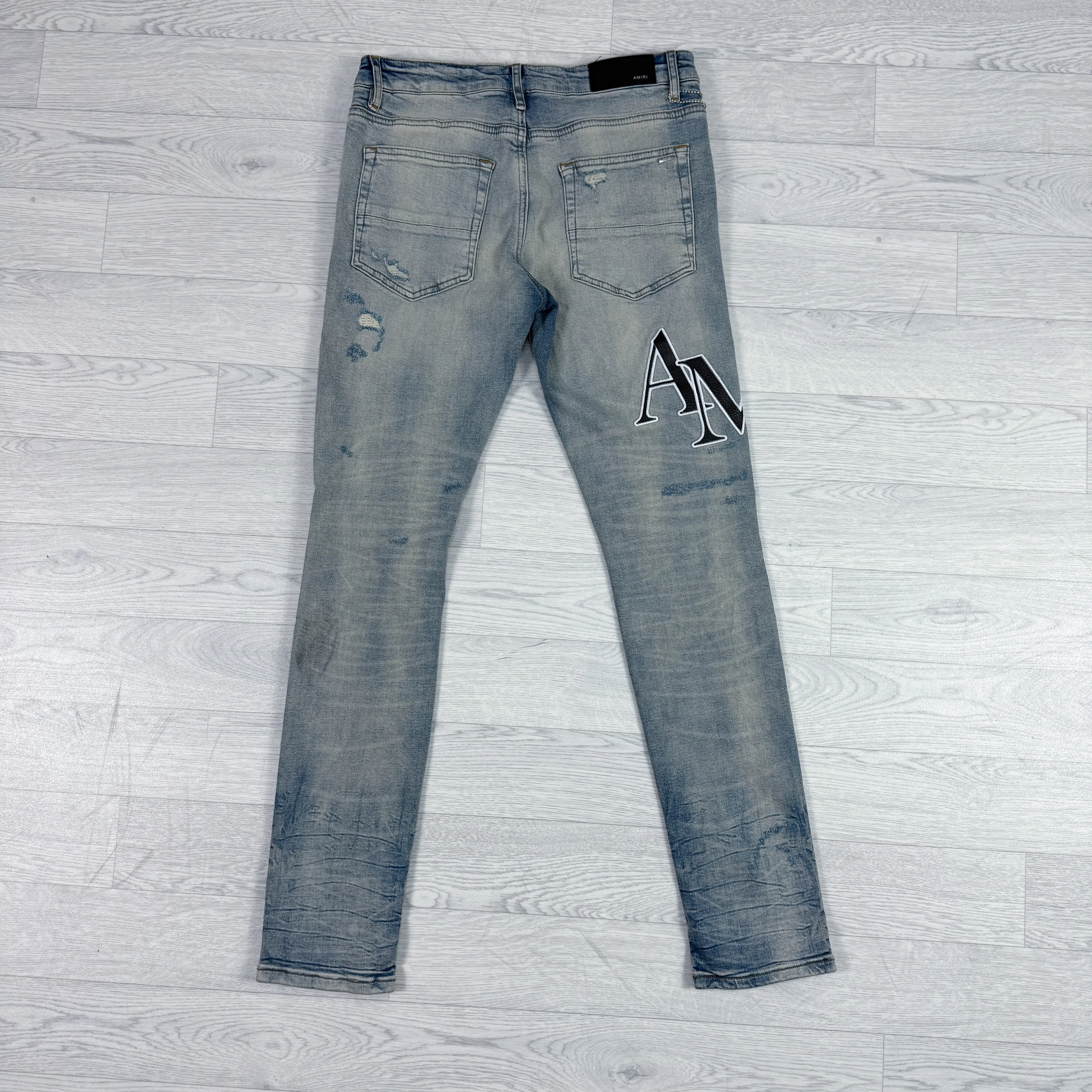 Leather Patch Logo Slim Fit Jeans